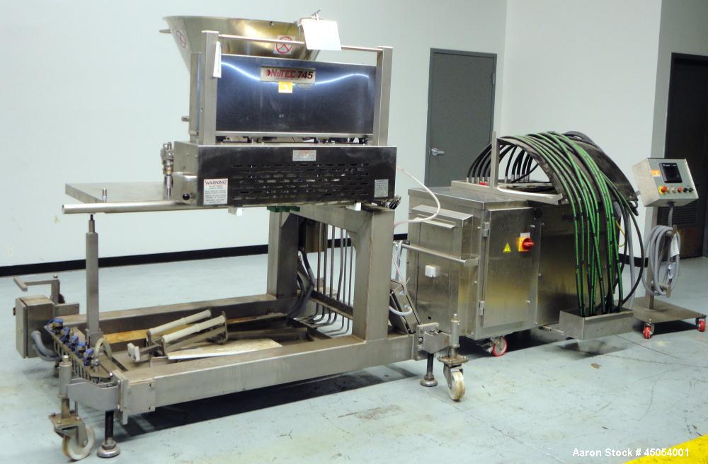 Used NuTEC Manufacturing Hydraulic Provatec 745 Patty Forming Machine. Approximately 15 to 65 strokes per minute, varies on portion size. Has hopper capacity of 400 pounds, usable mold plate area 16"...