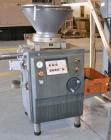 Used Handtmann Vacuum Filler, Model VF10-50, Code 65/25, Carbon steel. Top feed hopper with mixing arm, driven by a 0.55kw, 3/60/200 volt, 1700 rpm motor. Removable vane feeder driven by a 1.5/4.4kw,...