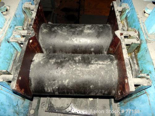 Used Horizontal Two Roll Mill. 8" Diameter x 18" long chrome plated cored rolls. Adjustable end guides, approximate distance between 14-1/4". Manual roll adjustments. Minimum roll gap is contact and ...