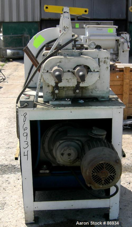 USED: Horizontal Two Roll Mill. (2) 6" diameter x 13" wide chrome plated cored rolls. (2) Knee safeties, (1) knife scraper. Manual roll adjustment. Driven by a 1 HP, 3/60/220/440 Volt, 900 RPM US var...
