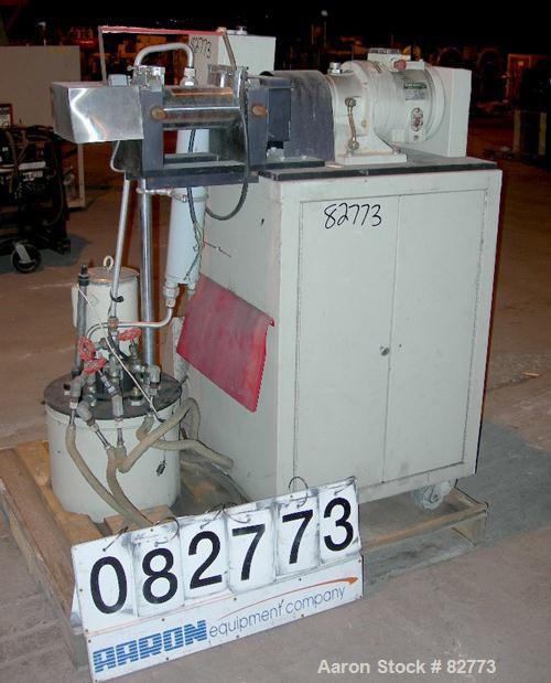 USED: C W Brabender horizontal two roll prep mill, model PM2000. (2) 4" diameter x 8" wide chrome plated cored rolls. Operating volume approx 250 ml. Adjustable end guides, (1) knee safety, (1) knife...
