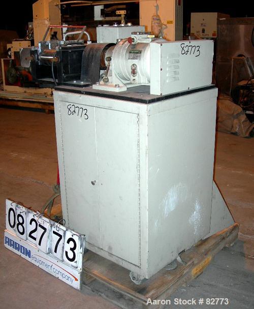 USED: C W Brabender horizontal two roll prep mill, model PM2000. (2) 4" diameter x 8" wide chrome plated cored rolls. Operating volume approx 250 ml. Adjustable end guides, (1) knee safety, (1) knife...