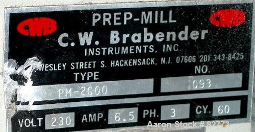 USED: C W Brabender horizontal two roll prep mill, model PM2000. (2) 4" diameter x 8" wide chrome plated cored rolls. Operating volume approx 250 ml. Adjustable end guides, (1) knee safety, (1) knife...