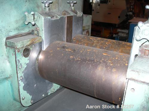USED: Farrel horizontal two roll mill. (2) 8" diameter x 16" wide cored rolls, temp range approximately 350 deg F. Adjustable end guides, (2) knee safties, (1) swinging knife scraper, bottom drip pan...