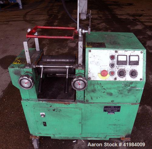 Used Nishimura Horizontal Two Roll Mill. (2) 3-1/2" diameter x 10" wide chrome plated rolls, manually adjustable. (1) Overhead safety, knife scraper with drip pan. Rolls driven by a 1.5 kw (2 hp), 3/...