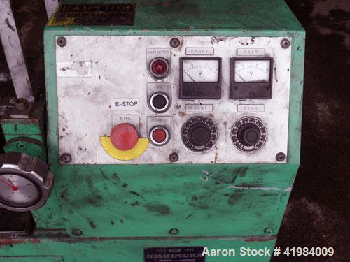 Used Nishimura Horizontal Two Roll Mill. (2) 3-1/2" diameter x 10" wide chrome plated rolls, manually adjustable. (1) Overhead safety, knife scraper with drip pan. Rolls driven by a 1.5 kw (2 hp), 3/...