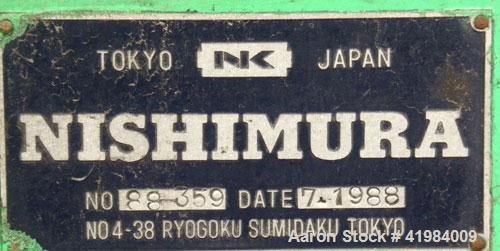 Used Nishimura Horizontal Two Roll Mill. (2) 3-1/2" diameter x 10" wide chrome plated rolls, manually adjustable. (1) Overhead safety, knife scraper with drip pan. Rolls driven by a 1.5 kw (2 hp), 3/...