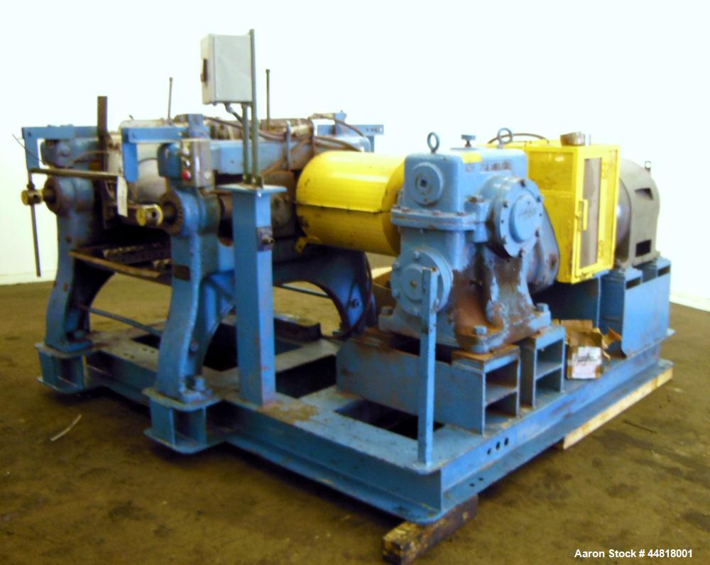 Used Reliable Rubber & Plastic Machinery Horizontal Two Roll Mill.  (2) 12" Diameter x 30" wide chromed plated cored rolls.  Knife scraper, bottom drip pan edge guides.  Manual roll adjustment.  Driv...