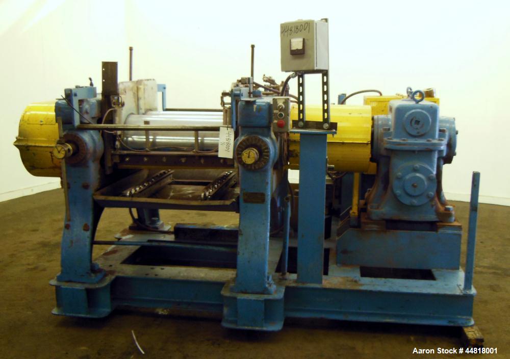Used Reliable Rubber & Plastic Machinery Horizontal Two Roll Mill.  (2) 12" Diameter x 30" wide chromed plated cored rolls.  Knife scraper, bottom drip pan edge guides.  Manual roll adjustment.  Driv...