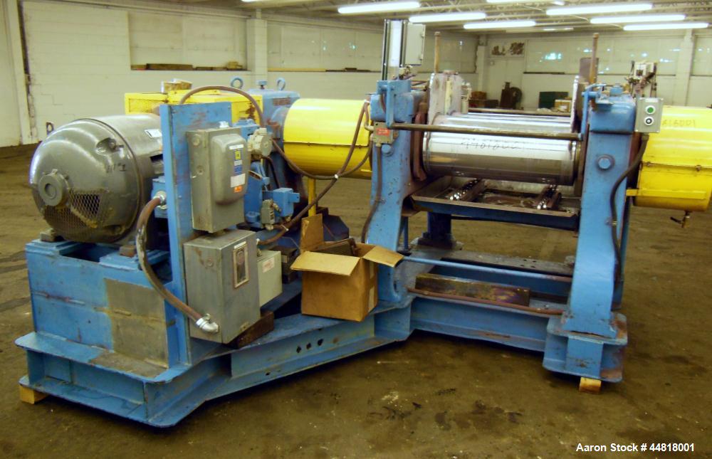 Used Reliable Rubber & Plastic Machinery Horizontal Two Roll Mill.  (2) 12" Diameter x 30" wide chromed plated cored rolls.  Knife scraper, bottom drip pan edge guides.  Manual roll adjustment.  Driv...