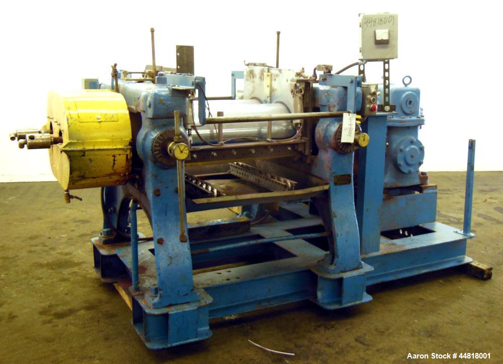 Used Reliable Rubber & Plastic Machinery Horizontal Two Roll Mill.  (2) 12" Diameter x 30" wide chromed plated cored rolls.  Knife scraper, bottom drip pan edge guides.  Manual roll adjustment.  Driv...