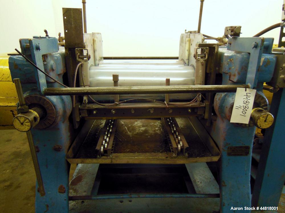 Used Reliable Rubber & Plastic Machinery Horizontal Two Roll Mill.  (2) 12" Diameter x 30" wide chromed plated cored rolls.  Knife scraper, bottom drip pan edge guides.  Manual roll adjustment.  Driv...