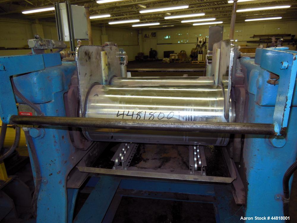 Used Reliable Rubber & Plastic Machinery Horizontal Two Roll Mill.  (2) 12" Diameter x 30" wide chromed plated cored rolls.  Knife scraper, bottom drip pan edge guides.  Manual roll adjustment.  Driv...