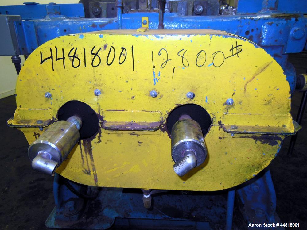 Used Reliable Rubber & Plastic Machinery Horizontal Two Roll Mill.  (2) 12" Diameter x 30" wide chromed plated cored rolls.  Knife scraper, bottom drip pan edge guides.  Manual roll adjustment.  Driv...