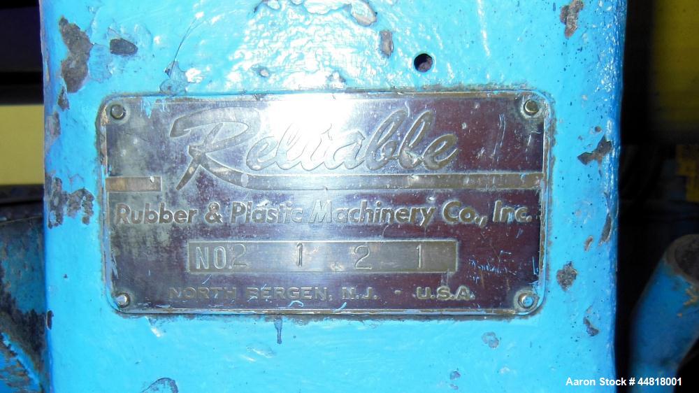 Used Reliable Rubber & Plastic Machinery Horizontal Two Roll Mill.  (2) 12" Diameter x 30" wide chromed plated cored rolls.  Knife scraper, bottom drip pan edge guides.  Manual roll adjustment.  Driv...