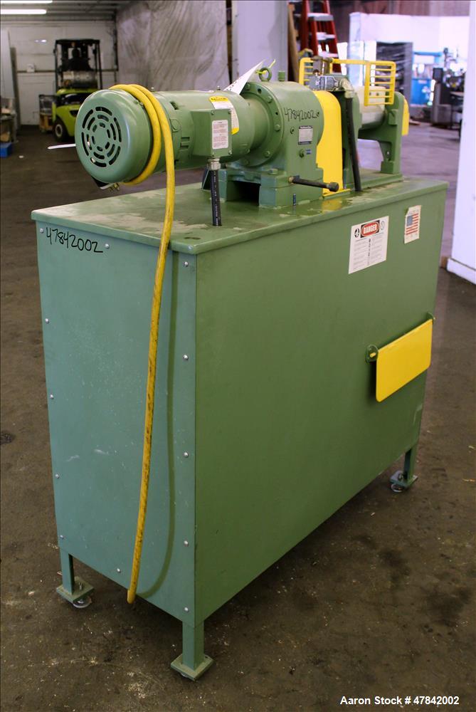 Used Reliable Rubber & Plastic Machinery Horizontal Two Roll Mill. (2) 3" Diameter x 8" wide chromed plated cored rolls. Manual roll adjustment, plastic edge guides, top safety cage, side knee safeti...
