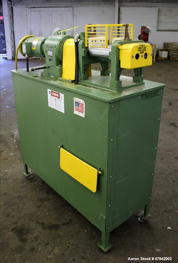 Used Reliable Rubber & Plastic Machinery Horizontal Two Roll Mill. (2) 3" Diameter x 8" wide chromed plated cored rolls. Manual roll adjustment, plastic edge guides, top safety cage, side knee safeti...