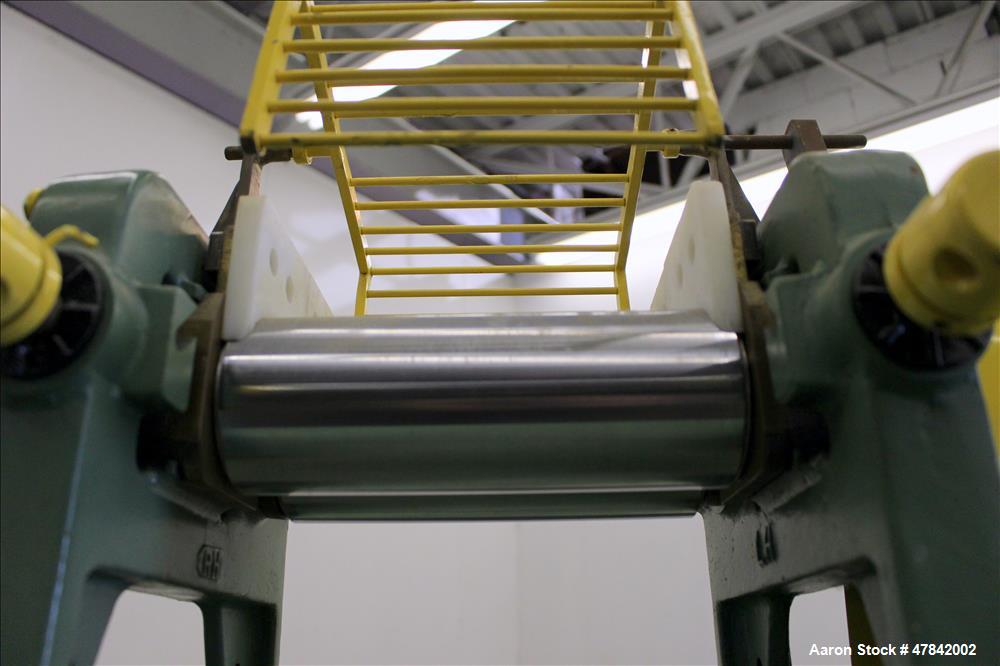 Used Reliable Rubber & Plastic Machinery Horizontal Two Roll Mill. (2) 3" Diameter x 8" wide chromed plated cored rolls. Manual roll adjustment, plastic edge guides, top safety cage, side knee safeti...