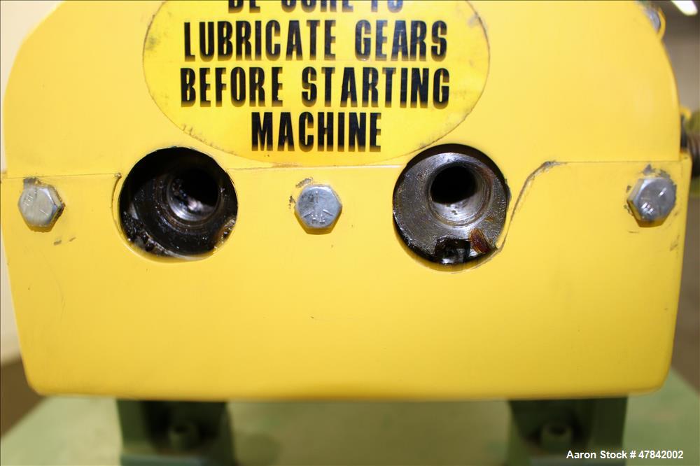 Used Reliable Rubber & Plastic Machinery Horizontal Two Roll Mill. (2) 3" Diameter x 8" wide chromed plated cored rolls. Manual roll adjustment, plastic edge guides, top safety cage, side knee safeti...