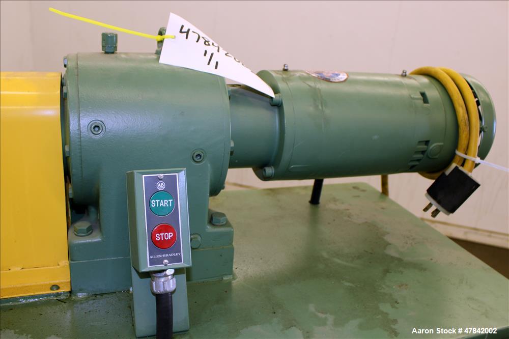 Used Reliable Rubber & Plastic Machinery Horizontal Two Roll Mill. (2) 3" Diameter x 8" wide chromed plated cored rolls. Manual roll adjustment, plastic edge guides, top safety cage, side knee safeti...