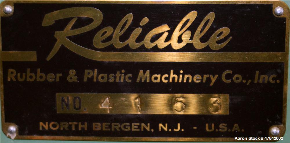 Used Reliable Rubber & Plastic Machinery Horizontal Two Roll Mill. (2) 3" Diameter x 8" wide chromed plated cored rolls. Manual roll adjustment, plastic edge guides, top safety cage, side knee safeti...