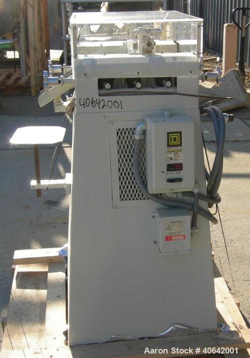 Used Ross horizontal three roll mill, model 4 X 8 TRM. (3) 4" diameter x 8" wide cored carbon steel rolls. Handwheel adjustments. Front roll speed 270 rpm. Adjustable end guides, knife scraper with d...