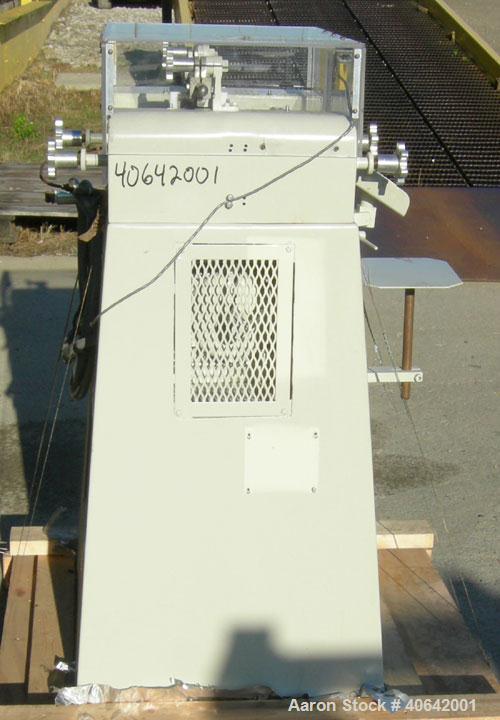 Used Ross horizontal three roll mill, model 4 X 8 TRM. (3) 4" diameter x 8" wide cored carbon steel rolls. Handwheel adjustments. Front roll speed 270 rpm. Adjustable end guides, knife scraper with d...