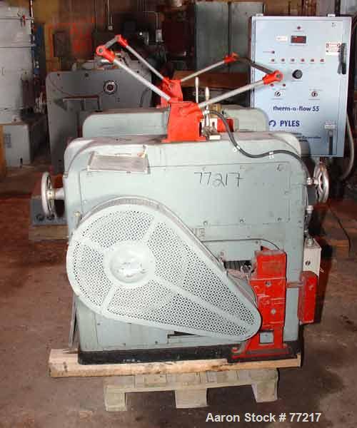 Used Inoue Seisakusho Horizontal Three Roll Mill, Model S-9X20. (3) 9" Diameter x 20" long manually adjustable cored rolls. Brass edge guides. Discharge pan with scraper. Driven by an approximate 5 h...