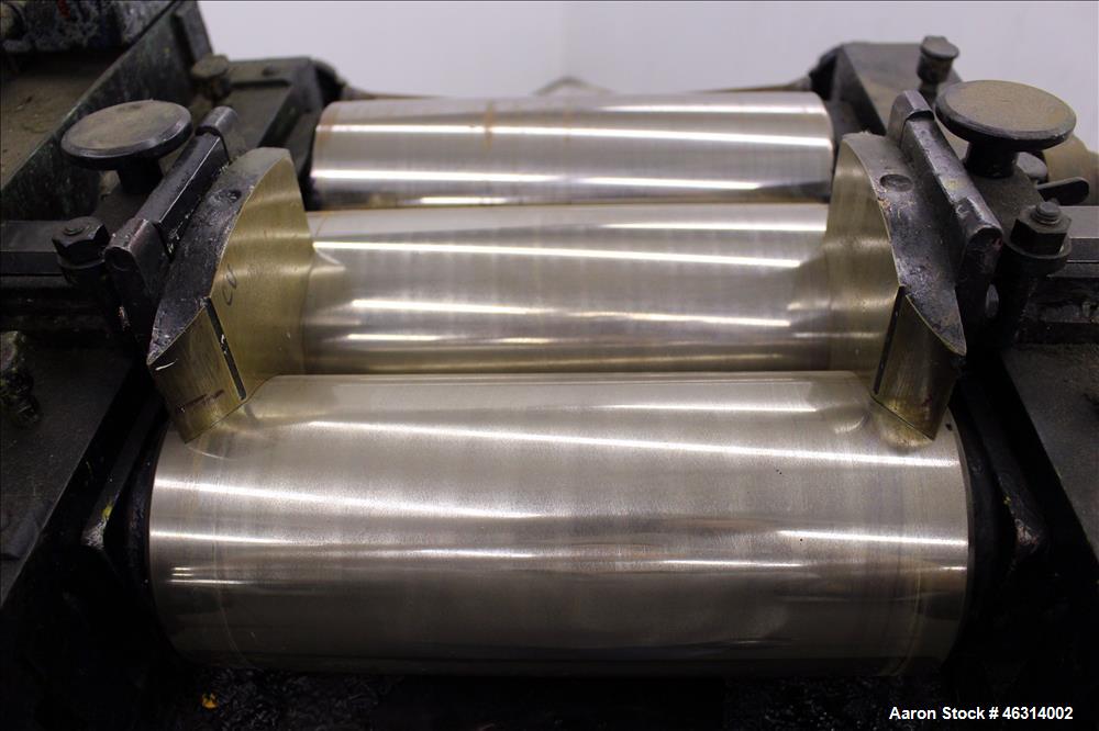Used J.H. Day Horizontal Three Roll Lab Dispersion Mill, Model 5" x 12". (3) 5" Diameter x 12" wide carbon steel cored rolls. (2) Adjustable copper edge guides, bottom drip pan, knife scraper with di...