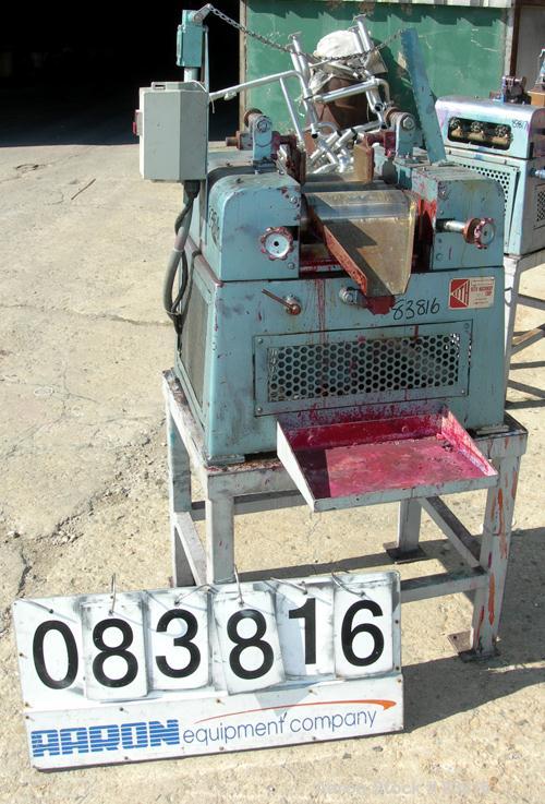 USED: Keith Machinery horizontal three roll mill, model 4 x 8. (3) 4" diameter x 8" wide cored rolls. Adjustable end guides, knife scraper with discharge pan, bottom drip pan. Driven by an approx 1 h...