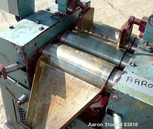 USED: Keith Machinery horizontal three roll mill, model 4 x 8. (3) 4" diameter x 8" wide cored rolls. Adjustable end guides, knife scraper with discharge pan, bottom drip pan. Driven by an approx 1 h...