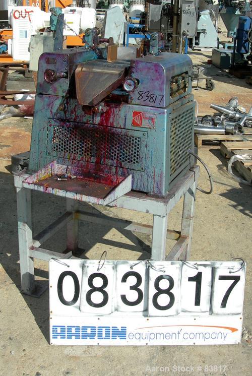 Used Keith Machinery Horizontal Three Roll Mill, model 4 x 8. (3) 4" diameter x 8" wide cored rolls. Adjustable end guides, knife scraper with discharge pan, bottom drip pan. Driven by an approximate...