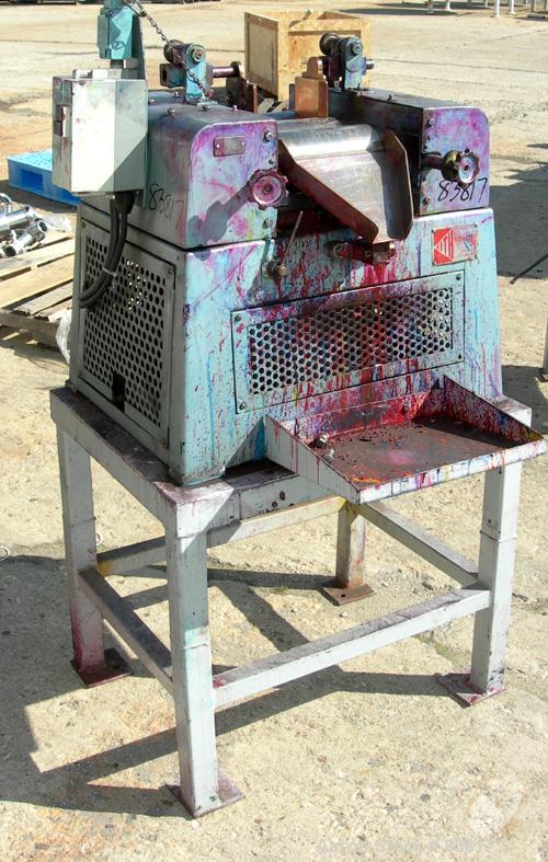 Used Keith Machinery Horizontal Three Roll Mill, model 4 x 8. (3) 4" diameter x 8" wide cored rolls. Adjustable end guides, knife scraper with discharge pan, bottom drip pan. Driven by an approximate...
