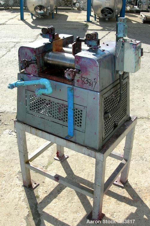 Used Keith Machinery Horizontal Three Roll Mill, model 4 x 8. (3) 4" diameter x 8" wide cored rolls. Adjustable end guides, knife scraper with discharge pan, bottom drip pan. Driven by an approximate...