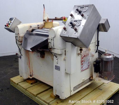 Used Lehmann Horizontal Three Roll Mill, Model 663-V. (3) 9" Diameter x 24" wide Bi-Metal cast iron adjustable cored rolls. Adjustable brass edge guides, knife scraper with discharge pan, bottom drip...