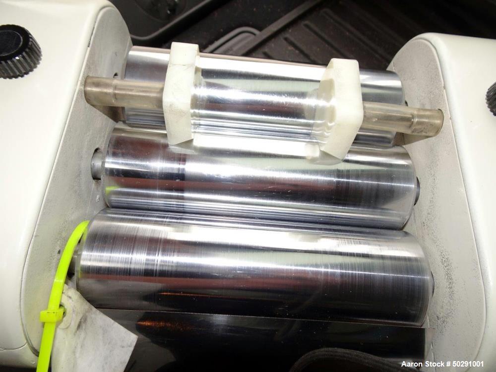 Used Lab 3 Roll Mill. Approximate 2" diameter x 6" long chrome rolls.