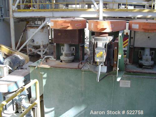 USED: Quinn Process Equipment attrition scrubber. 4 Cell unit,24" x 24" ID tanks, 10' tall cell, 10 hp motor.