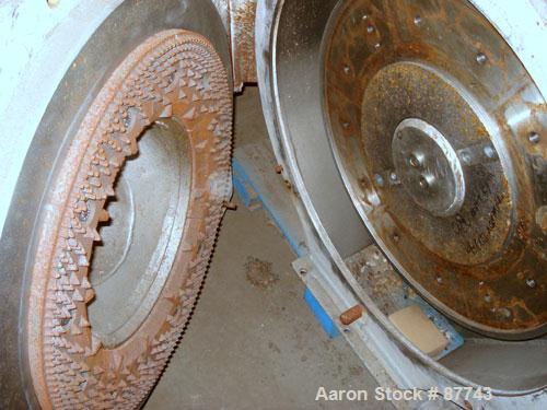 Used Sprout Waldron/Kopper Single Disc Mill, Model DM-24. Stainless steel contact surfaces, 24" diameter disc, hand wheel plate gap adjustment, gravity feed, swing away front cover, belt driven with ...