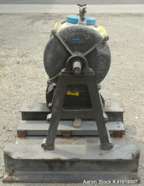 Used Abbe Engineering Ball Mill, porcelain lined chamber. 18" diameter x 16" long. Approximate 18 gallon (2 cubic foot) capacity. 6-1/2" charge/discharge port with clamp down cover. Driven by a 1/2 h...