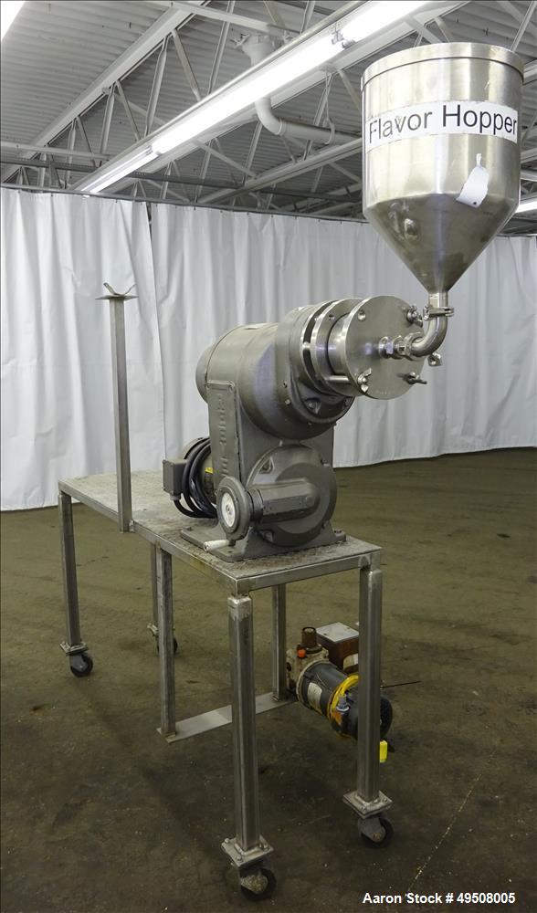 Used Colloid Mill, 316 Stainless Steel. Approximate 5-1/2" diameter chamber. Dual (40) pin rotor. Driven by a Reeves manual variable speed gearbox, 5 HP, 3/60/208-230/460 volt, 1725 rpm motor with 1....
