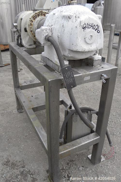 Used Charlotte Colloid Mill, Model SD 20, 316 stainless steel, sanitary design. Jacketed chamber approximately 7-1/2" diameter x 4" deep. Grooved stator, missing the rotor. 1-3/8" diameter inlet/outl...