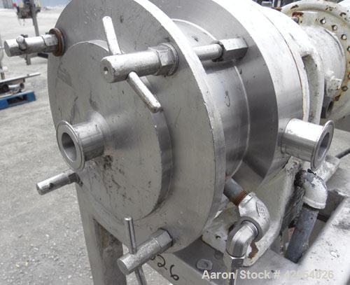 Used Charlotte Colloid Mill, Model SD 20, 316 stainless steel, sanitary design. Jacketed chamber approximately 7-1/2" diameter x 4" deep. Grooved stator, missing the rotor. 1-3/8" diameter inlet/outl...