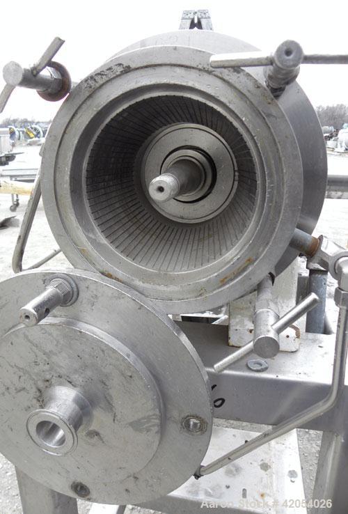 Used Charlotte Colloid Mill, Model SD 20, 316 stainless steel, sanitary design. Jacketed chamber approximately 7-1/2" diameter x 4" deep. Grooved stator, missing the rotor. 1-3/8" diameter inlet/outl...