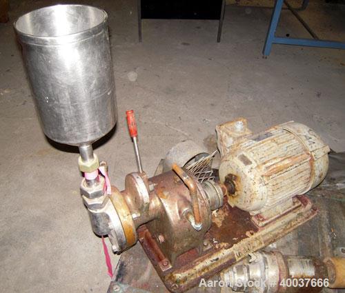 Used Gaulin Colloid Mill, Type 4D, stainless steel. Top feed hopper. 1 1/2" inlet, 1" outlet. Direct coupled to a 7 1/2 hp, 3/60/220/440 volt, 3500 rpm motor. Base mounted.