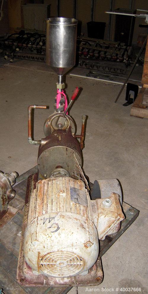 Used Gaulin Colloid Mill, Type 4D, stainless steel. Top feed hopper. 1 1/2" inlet, 1" outlet. Direct coupled to a 7 1/2 hp, 3/60/220/440 volt, 3500 rpm motor. Base mounted.