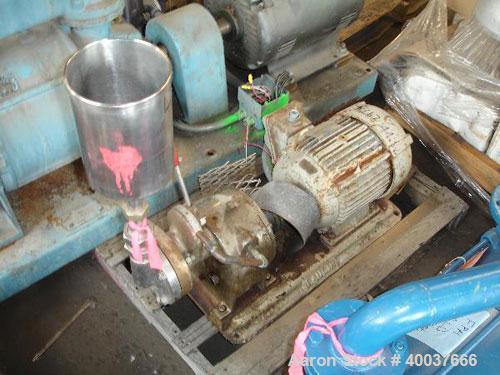Used Gaulin Colloid Mill, Type 4D, stainless steel. Top feed hopper. 1 1/2" inlet, 1" outlet. Direct coupled to a 7 1/2 hp, 3/60/220/440 volt, 3500 rpm motor. Base mounted.