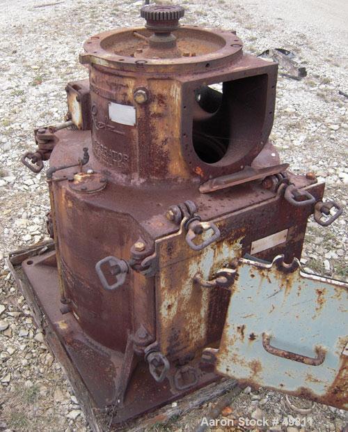 Used Rietz Vertical Disintegrator, Model RD18, Carbon Steel. Driven by a 150 hp 3/60/230/460 volt, 3530 rpm motor.  Includes a 24" diameter discharge hopper.