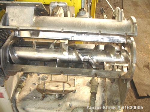 Used Rietz Extructor, Model RE6 K5F42, Stainless Steel. 6" diameter x 36" long screw, jacketed barrel, 5" x 6" feed section, driven by a 10 hp, 220/440 volt, Reeves variable speed motor. Includes an ...