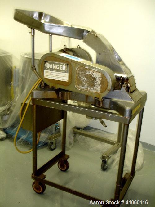 Used Fitzpatrick Fitzmill, Model D6, stainless steel construction, swinging hammers, reversible chamber, pan feed, approximate 5 hp motor, belt driven on base.