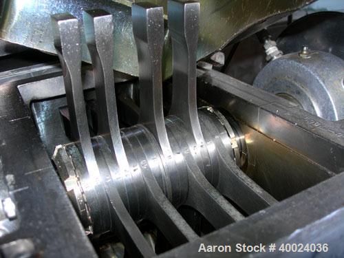 Used Fitzpatrick Fitzmill, Model DASO6, stainless steel. (16) double impact fixed blades, driven by an approximatetly 7.5hp XP motor, 4" diameter x 18" long screw feed, driven by an approximately 1/4...